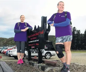  ?? PHOTO: TOM KITCHIN ?? All set . . . Fiona Laing (left) and Natalie Savigny prepare to walk the entire Otago Central Rail Trail from Clyde to Middlemarc­h in seven days last Saturday to raise money for bowel cancer.