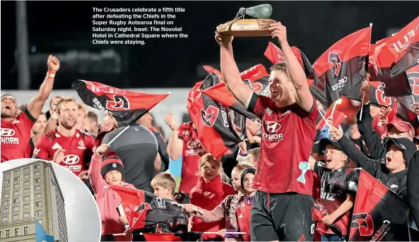  ??  ?? The Crusaders celebrate a fifth title after defeating the Chiefs in the Super Rugby Aotearoa final on Saturday night. Inset: The Novotel Hotel in Cathedral Square where the Chiefs were staying.