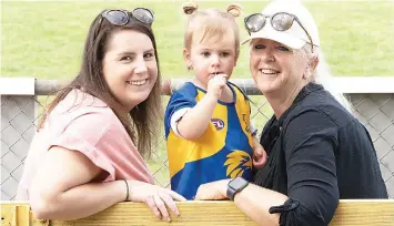  ?? ?? Saturday was a perfect autmn day for watching local footy. Kristy and Sophia Farthing and Sharon Cropley made the most of the warm weather to watch Ellinbank play at Ellinbank.