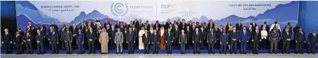  ?? ?? All aboard to save the planet...world leaders pose for a joint photo at the COP27 climate summit in Egypt yesterday