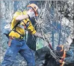  ?? SUBMITTED PHOTO ?? Jason MacEachern, one of 12 P.E.I. forest firefighte­rs sent to help contain wildfires in British Columbia, works on a hotspot in Gustafson, about 200 kilometres north of Kamloops. He was part of a crew that worked to secure the fire perimeter, identify...