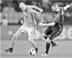  ??  ?? Real Madrid’s Karim Benzema (right) and Celta Vigo’s John Guidetti fight for the ball during the Copa del Rey quarter-final at Balaidos stadium, Vigo in this Jan 25 file photo. — Reuters photo