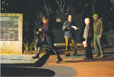  ?? Photos by Mason Trinca / Special to The Chronicle ?? Above: Daniel Olson passes out flyers urging theatergoe­rs to boycott “Thomas and Sally” at the Marin Theatre Company. Below: Tracy Camp (right) talks to Leba Morimoto about not supporting the show.