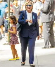  ?? THE ASSOCIATED PRESS ?? Democratic presidenti­al candidate Hillary Clinton leaves an apartment building Sunday in New York.