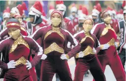  ?? ANTONIO PEREZ/CHICAGO TRIBUNE ?? Members of the Southland College Prep Charter High School at the Chicago Thanksgivi­ng Day parade.