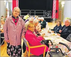  ??  ?? Isabel MacPhee, standing, also helps with the lunch club at the Caol Community Centre, where up to 30 people enjoy hot meals on weekdays.