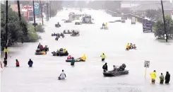  ?? DAVID J. PHILLIP/ASSOCIATED PRESS ?? Rescue boats fill a flooded street in Houston as people are evacuated on Aug. 28 after Tropical Storm Harvey hit the city. The White House has requested $44 billion from Congress to aid hurricane-affected regions.