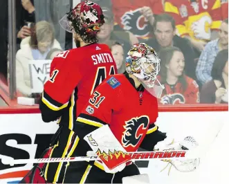  ?? AL CHAREST ?? Calgary Flames backup goaltender Eddie Lack takes over for starter Mike Smith midway through the third period Friday against the Ottawa Senators. The Sens were 6-0 winners.