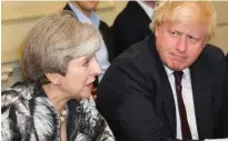  ?? - Reuters file ?? AT ODDS: Britain’s Prime Minister Theresa May sits next to Britain’s Foreign Secretary Boris Johnson as she holds the first Cabinet meeting following the general election at 10 Downing Street, in London.