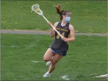  ?? ED MORLOCK/MEDIANEWS GROUP ?? Upper Merion’s Julianna Callison looks to pass behind Pope John Paul II’s goal Thursday at Pope John Paul II High School.