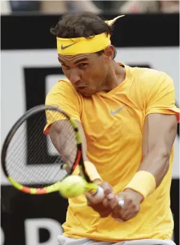  ?? AP ?? Spain’s Rafael Nadal returns to Fabio Fognini of Italy in their Italian Open quarterfin­al in Rome on Friday. Nadal won 4- 6, 6- 1, 6- 2. —