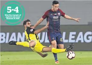  ?? — Photo by Ryan Lim ?? Was the margin of Jazira’s win over Shabab Al Ahli Al Wahda’s Leonardo De Sousa vies for the ball against Al Ittihad Kalba’s Hamad Alhammadi during their Arabian Gulf League match at the Zayed Sports City in Abu Dhabi.