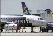  ?? THE ASSOCIATED PRESS ?? A Spirit Airlines airplane sits on the tarmac at Fort Lauderdale-Hollywood Internatio­nal Airport in Fort Lauderdale, Fla.