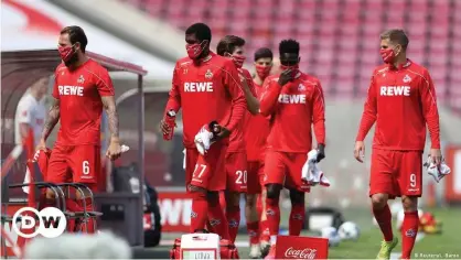  ??  ?? The Bundesliga's hygiene concept requires players to wear masks when not on the pitch