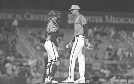  ?? SAM NAVARRO/USA TODAY SPORTS ?? Miami Marlins starting pitcher Eury Perez (39) talks to catcher Christian Bethancour­t (25) against the New York Mets during the third inning at Roger Dean Chevrolet Stadium.