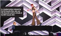  ??  ?? In a handout picture released by the Brit Awards Elton John and Olly Alexander perform virtually at the BRIT Awards 2021.
