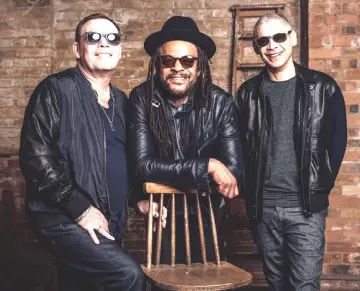  ??  ?? Lead singer Ali Campbell, left, with UB40 bandmates, Astro, centre, and Mickey Virtue.