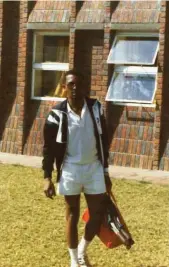  ?? ?? Racket boy... Pikes on his way to the tennis courts in Harare, Zimbabwe 1990.