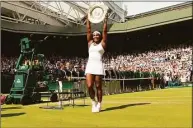  ?? Sean Dempsey / Associated Press ?? Serena Williams holds up the trophy after winning the women’s singles final against Garbine Muguruza at Wimbledon in 2015.