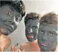  ?? ?? The boys posed in dark green face masks, which drew accusation­s of ‘blackface’