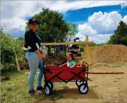  ?? John Miller/Taos News ?? Jacquelene McHorse and her two-year-old daughter, Judy, at the property on Taos Pueblo where Bison Star Naturals is beginning to expand. After she had her daughter, McHorse started making natural soaps to treat her dry hair and skin.