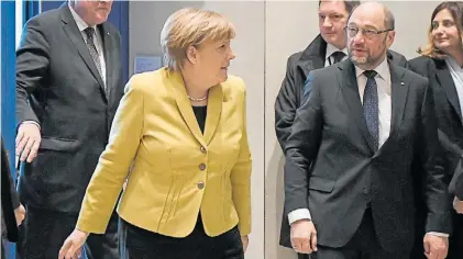  ?? AFP ?? Desafíos. Angela Merkel y Martín Schulz, la gran pelea por quien gobernará en adelante la potencia.