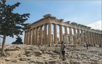  ?? Patricia Sheridan/Post-Gazette ?? The Parthenon, a temple built to honor the goddess Athena in 447 BC, is the centerpiec­e of the Acropolis in Athens, Greece.