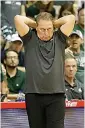  ?? AP Photo/Marco Garcia ?? ■ Michigan State head coach Tom Izzo reacts to play against Virginia Tech during the second half of an NCAA college basketball game Monday in Lahaina, Hawaii.