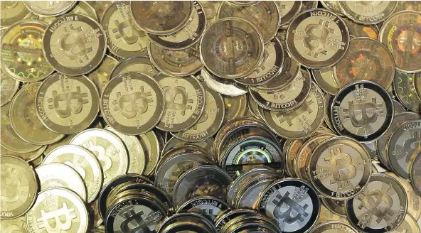  ?? — AP FILES ?? Some bitcoin investors have been frustrated by delays as the try to convert the cryptocurr­ency to more traditiona­l forms of money. Currency exchanges, including a couple with links to Vancouver, have blamed the banks for any delays being experience­d.