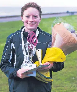  ??  ?? Scottish 5km Road Race title winners Kristian Jones and Annabel Simpson.