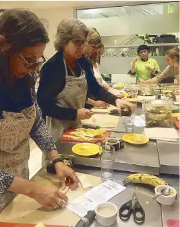  ??  ?? Participan­ts learn how to make turon (left). They also received dried mangoes dipped in chocolate and informatio­n on different destinatio­ns in the Philippine­s (below).