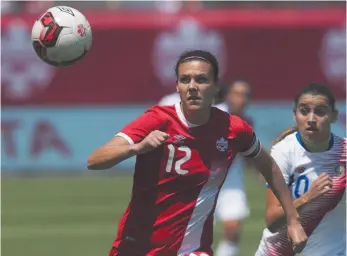  ?? CP PHOTO BY CHRIS YOUNG ?? Canada’s Christine Sinclair (left) and Costa Rica’s Shirley Cruz chase a through ball during an internatio­nal women’s soccer game in Toronto last week.