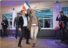  ?? EUROPEAN PRESSPHOTO AGENCY ?? Supporters of defeated French far-right candidate Marine Le Pen still found reason to party Sunday after results came in.