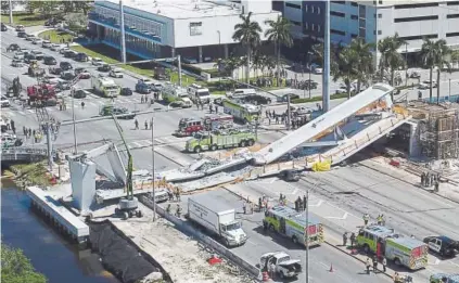  ?? Pedro Portal, Miami Herald ?? Emergency workers respond after a new pedestrian bridge collapsed onto a highway Thursday at Florida Internatio­nal University in Miami.