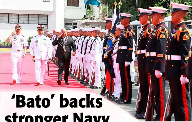  ?? PHILIPPINE NAVY PHOTO ?? Honoring an ally Sen. Ronald de la Rosa troops the line during military honors accorded to him by the Philippine Navy.