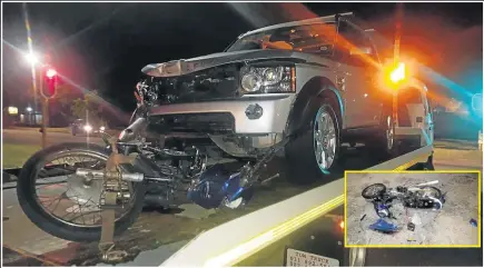  ??  ?? MANGLED WRECK: The motorbike and Land Rover are towed away after the accident at a Walmer intersecti­on