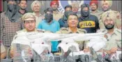  ?? HT PHOTO ?? ■ Police officials with the arrested accused in Jalandhar.