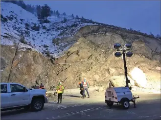  ?? Ministry of Transporta­tion and Infrastruc­ture ?? Workers investigat­e the unstable slope at the site of a slide on Highway 97 north of Summerland. A detour around the slide is being constructe­d.