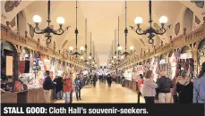  ??  ?? STALL GOOD: Cloth Hall’s souvenir-seekers.
