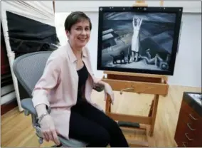  ?? TONY GUTIERREZ — THE ASSOCIATED PRESS ?? In this Thursday photo, Sue Canterbury, a curator of American art at the Dallas Museum of Art poses for a photo in front of a painting by Ida O’Keeffe titled “Spring Lethargy, Texas” from 1938, at the DMA in Dallas. The abstract painting of a...