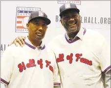  ?? John Locher / Associated Press ?? Lee Smith, right, and Harold Baines pose for photograph­ers during a news conference for the Baseball Hall of Fame during the Major League Baseball winter meetings Monday.