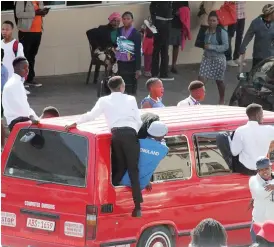  ??  ?? Overzealou­s youths celebrate a wedding by clinging dangerousl­y onto a commuter omnibus along Leopold Takawira Avenue in Bulawayo on Friday. It is a chargeable offence to board a vehicle in such a manner. — Picture by Nkosizile Ndlovu