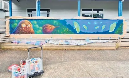  ?? ?? One of the completed murals (left) at Kerikeri Primary School created by local artist Erika Pearce, and (above) a work in progress.