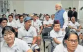  ?? PTI ?? PM Narendra Modi interacts with the Jaipur Foot beneficiar­ies, in Manila, Philippine­s, on Monday.