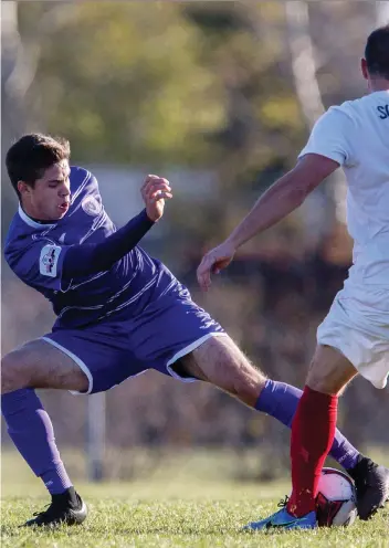  ?? LIAM RICHARDS/SASKATOON STARPHOENI­X ?? Saskatoon Revolution midfielder Tanner Stephens battles with Edmonton Scottish SC defender Mike Mccormick during the Toyota National Championsh­ips in October.