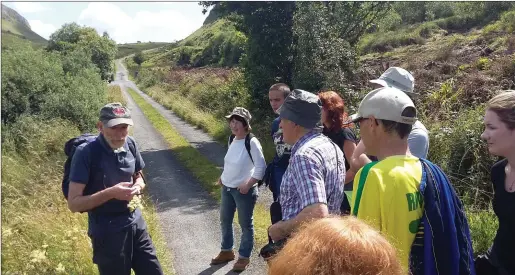  ??  ?? Archaeolog­ist Sam Moore talks to the crowd at Crrowkeel on a previous walk.