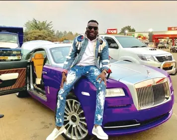  ??  ?? Zim businessma­n and socialite Genius Kadungure with his Rolls Royce Wraith