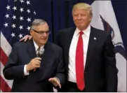  ??  ?? In this Jan. 26, 2016, file photo, then-Republican presidenti­al candidate Donald Trump is joined by Joe Arpaio, the sheriff of metro Phoenix, at a campaign event in Marshallto­wn, Iowa. AP PHOTO/ MARY ALTAFFER