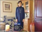  ?? BOB KEELER BKEELER@21STCENTUR­YMEDIA.COM @BYBOBKEELE­R ON TWITTER ?? Christine Lindenmuth stands in her apartment behind the ozone generator she began using after testing showed elevated levels of mold in the exterior wall.