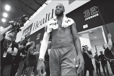  ?? AFP ?? LeBron James cuts a relaxed figure as he leaves the court following his first official practice session with the Los Angeles Lakers at the UCLA Health Training Center in El Segundo, California on Tuesday.